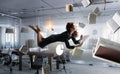 Joyful beautiful young levitating businesswoman. Mixed media Royalty Free Stock Photo