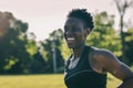 A Joyful Black Athlete Smiles Empowered By Outdoor Running And Training