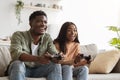 Joyful black couple playing video games at home Royalty Free Stock Photo