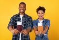 Joyful Black Couple Showing Travel Tickets Posing Over Yellow Background Royalty Free Stock Photo