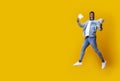 Joyful Black Man Holding Money, Jumping In Air And Screaming with Excitement Royalty Free Stock Photo