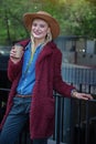 Joyful blond lady drinking hot espresso outdoor Royalty Free Stock Photo