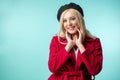 Joyful blond lady in fashionable clothes touching her face Royalty Free Stock Photo