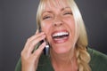 Joyful Blond Woman Using Cell Phone