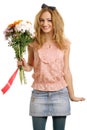 Joyful blonde model with a bouquet of flowers