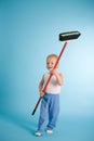 Joyful boy with cleaning swab over blue Royalty Free Stock Photo