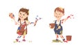 Joyful boy and girl stained clothes, hands and faces with paints. Happy little children painting with paintbrushes and Royalty Free Stock Photo