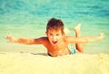 Joyful boy having fun at the beach Royalty Free Stock Photo