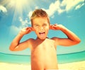 Joyful boy having fun at the beach Royalty Free Stock Photo