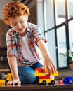 Joyful boy playing with plastic car toy at home Royalty Free Stock Photo