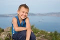 Joyful boy on top of a mountain Royalty Free Stock Photo