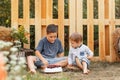 Joyful boys having a picnic. Kids resting together at camping site. Royalty Free Stock Photo