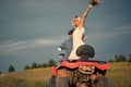 Joyful bride with bridal bouquet. Newlywed couple riding quad. Love, wedding, happiness, couple concept