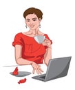 Joyful brunette woman in red dress looking at the camera with a cup of coffee in her hand and working. Red candy on