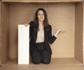 Joyful business woman with copy space sitting in her own office Royalty Free Stock Photo