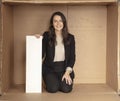 Joyful business woman with copy space sitting in her own office Royalty Free Stock Photo