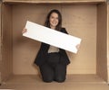 Joyful business woman with copy space sitting in her own office Royalty Free Stock Photo