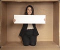 Joyful business woman with copy space sitting in her own office Royalty Free Stock Photo