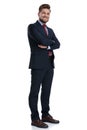 Joyful businessman standing with his arms folded and smiling Royalty Free Stock Photo