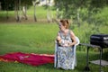 Joyful caucasian grandmother is holding on hands her grandson baby and playing with him Royalty Free Stock Photo