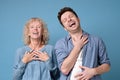 Joyful caucasian mother and son laughing at joke.