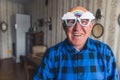 joyful Caucasian senior man with rainbow sunglasses seniority concept medium closeup living room