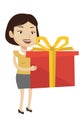 Joyful caucasian woman holding box with gift.