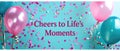 A Joyful Celebration With Confetti And Balloons Forming The Message Cheers To Lifes Moments