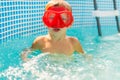 Child with Red Goggles Enjoying Swimming Pool Fun Royalty Free Stock Photo