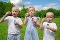 Joyful children inflate soap bubbles Royalty Free Stock Photo