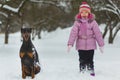 Joyful children playing in snow. Two happy girls having fun outside winter day Royalty Free Stock Photo