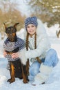 Joyful children playing in snow. Two happy girls having fun outside winter day Royalty Free Stock Photo