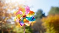 A joyful and colorful pinwheel spinning in the wind Royalty Free Stock Photo