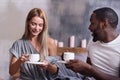 Joyful couple eating together in the morning Royalty Free Stock Photo