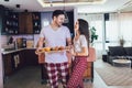 Couple hugging in the kitchen at home in the morning Royalty Free Stock Photo