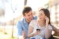 Joyful couple listening to online music together