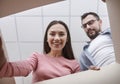 Joyful couple opening the box and looking on surprise Royalty Free Stock Photo