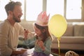 Joyful dad and daughter dressing up toghether