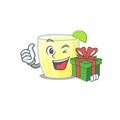 Joyful daiquiri cocktail cartoon character with a big gift box