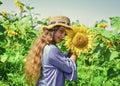 Joyful day. child in field of yellow flowers. teen girl in sunflower field. concept of summer vacation. rich harvest and Royalty Free Stock Photo