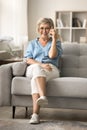 Joyful elder mature woman enjoying funny telephone conversation Royalty Free Stock Photo