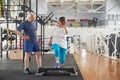 Joyful elderly woman exercising at gym. Royalty Free Stock Photo