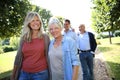 Joyful family in park taking a walk Royalty Free Stock Photo