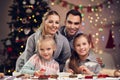 Joyful family preparing Christmas biscuits Royalty Free Stock Photo