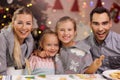 Joyful family preparing Christmas biscuits Royalty Free Stock Photo