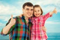 Joyful father with daughter showing thumbs up Royalty Free Stock Photo