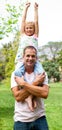 Joyful father giving his daughter piggy-back ride Royalty Free Stock Photo