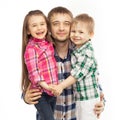 Joyful father hugging his son and daughter Royalty Free Stock Photo