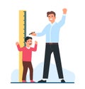 Joyful father measures his sons height with pencil and large ruler. Kid growth. Centimeter wall chart. Stadiometer scale