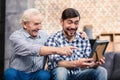 Joyful father and son looking at a photo frame Royalty Free Stock Photo